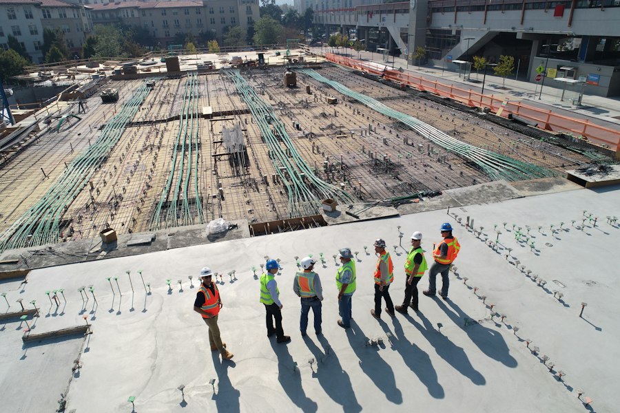Building under construction with crane on site